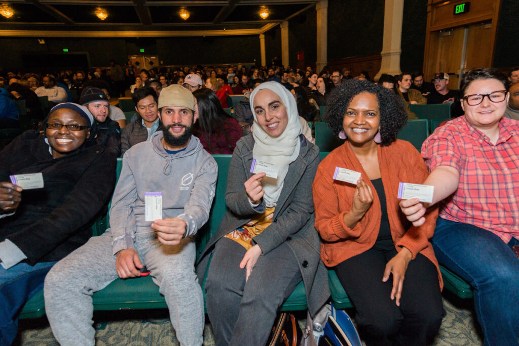 Utahns smile at the camera during the 2020 Community Screening of Coded Bias