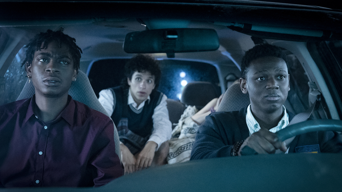 Three young men of color in a car