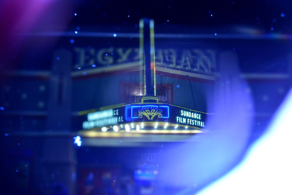 Marquee of the Egyptian Theatre, in bluish-purple light, taken at nighttime