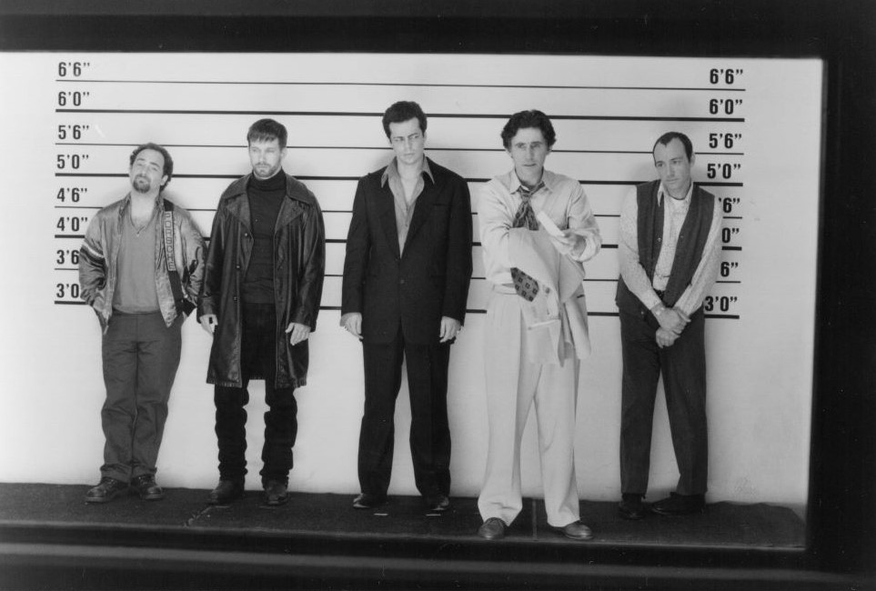 Five men stand in a police lineup
