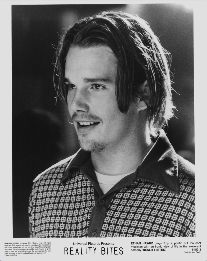 headshot of man looking to left, black and white