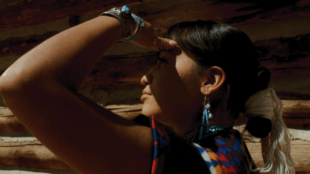 woman looking to the left side with her hand on her forehead