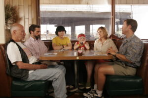 family sitting around a diner table
