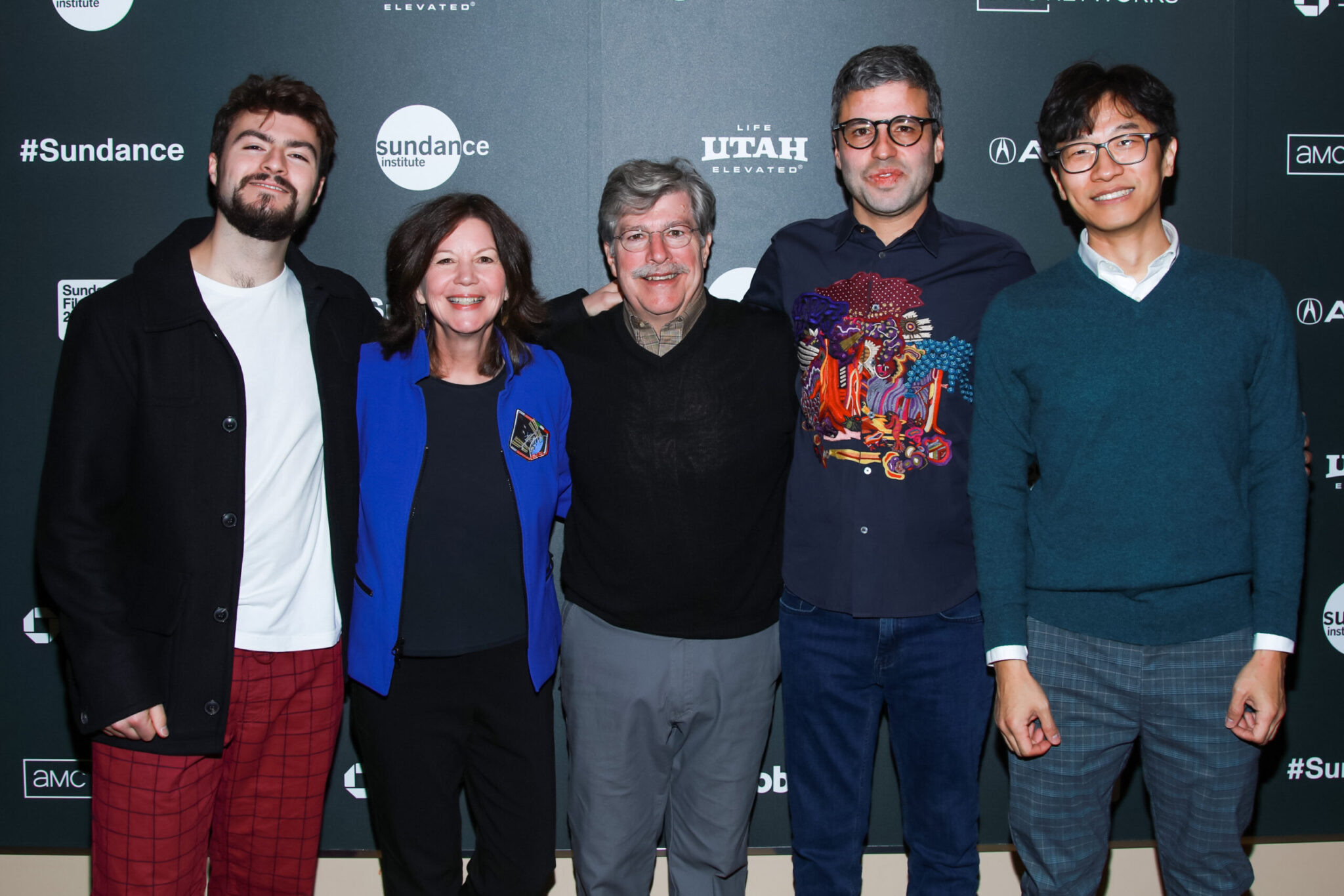 group of people smiling and posing for photo