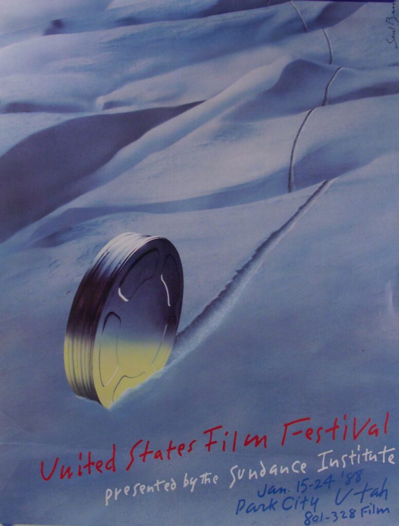 Poster of a giant film reel rolling down a snowy hill, leaving a track in the snow. At the bottom is written: United States Film Festival presented by the Sundance Institute, Jan. 15-24 '88 , Park City Utah, 801-328 Film." At the top right, the signature of Saul Bass