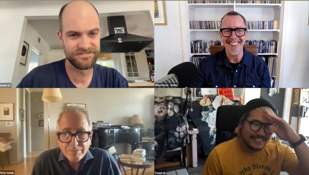 a zoom dicussions with four zoom windows - on the top left, a bald caucasian man, top right, a caucasian man with glasses and grey hair, bottom left, a grey-haired man with glassed, bottom right: an asian man with glasses and a black beanie
