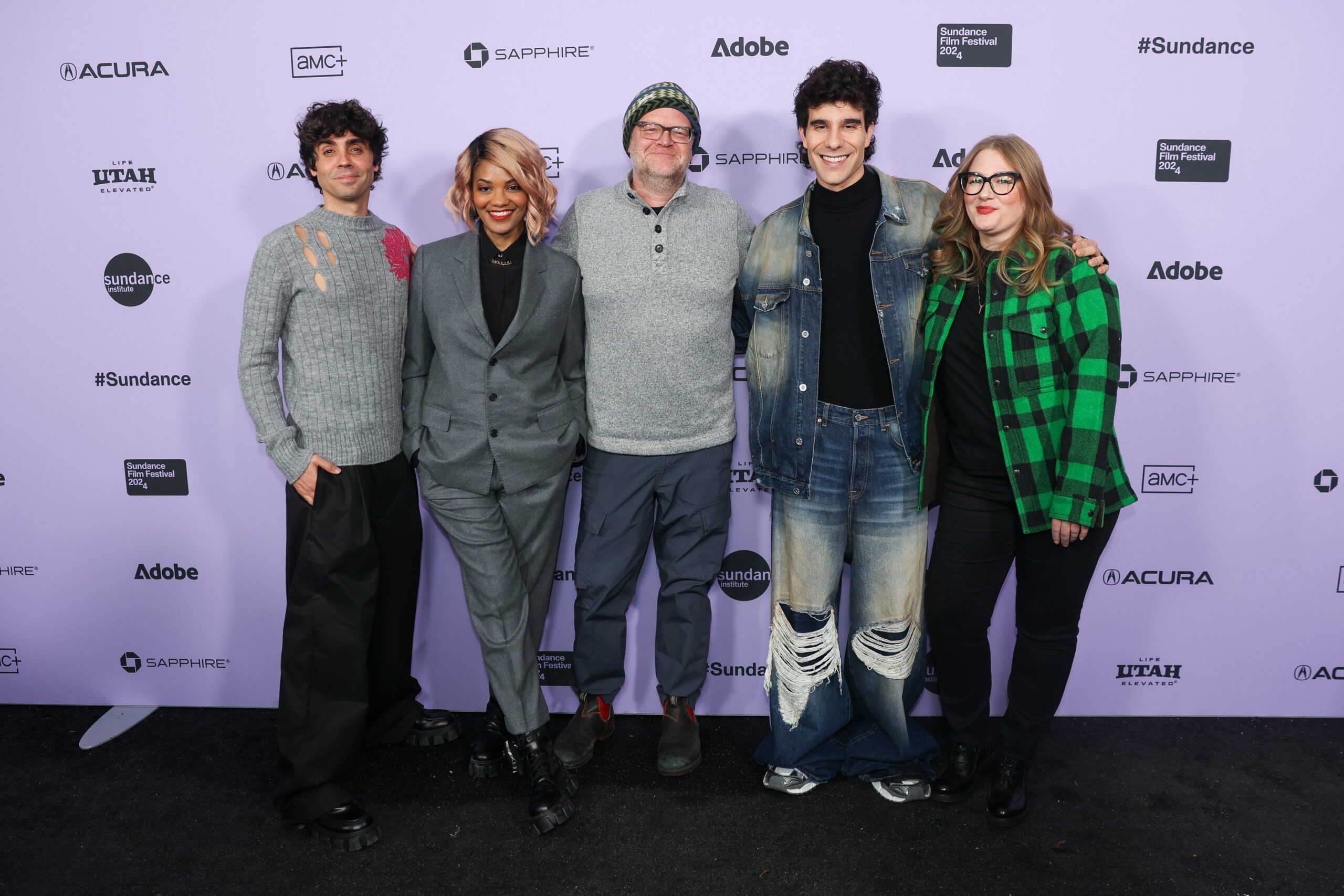 The filmmakers of the 2024 Episodic Pilot Showcase Stand in Front of a Step and Repeat at the 2024 Sundance Film Festival