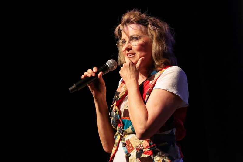 Lucy Lawless with mic