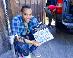 Director Reinaldo Marcus Green holds a clapboard for his project 'Monsters and Men.' Photographer: Jonathan Hickerson