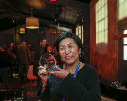 Jean Tsien receives an award during the Art of Editing Reception. Photographer: Weston Bury