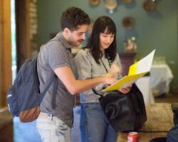 Producing fellows Jamie Goncalves and Minnie Schedeen look over itinerary for the 2018 Creative Producing Summit. Photographer: Jen Fairchild