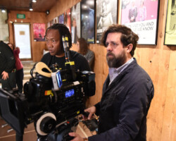 Director/co-writer Roger Ross Williams on the set of 'The Life and Death of Cassandro' with director of photography Corey Walter. Photographer: Fred Hayes