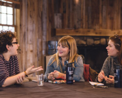 Creative advisor Nicole Perlman with 'Let's Not Get Crazy' screenwriting fellows and sisters Joey & Catie Ally. Photographer: Brandon Cruz
