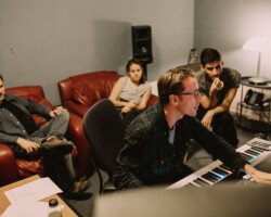 Composer Bill Laurance (C) works on 'Initials S.G.' with sound designer Pete Horner (L) and directors Rania Attieh and Daniel Garcia. Photographer: Kelly Mason