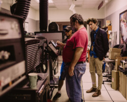 Director Michael Tyburski works with AV technicians before a screening of his project 'Palimsest.' Photographer: Kelly Mason