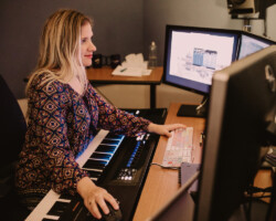 Composer Christy Carew works on 'Queen of the Battling Butterfly Brigade.' Photographer: Kelly Mason