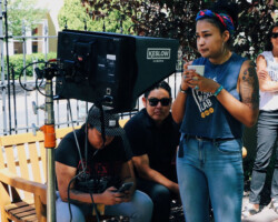 Director MorningStar Angeline Wilson (center) on the set of 'Ahehee Shizhee (Thank you, Father)' with peer advisor Razelle Benally and creative advisors Blackhorse Lowe and Chelsea Winstanley. Photographer: Tytianna Harris