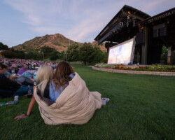 Guests get cozy for a screening of 'Believer' at the Red Butte Garden Amphitheatre. Photographer: Jonathan Hickerson