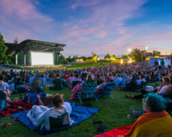 Guests watch 'Believer' under a setting sun at the Red Butte Garden Amphitheatre. Photographer: Jonathan Hickerson