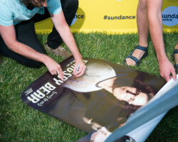 Screenwriter and protagonist of 'Brigsby Bear' Kyle Mooney signs film posters for eager fans. Photographer: Jonathan Hickerson