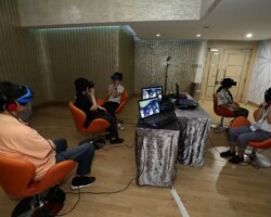 Guests in the VR Lounge experience John Hsu's 'Your Spiritual Temple Sucks.' Photographer: Ko Wing Kin