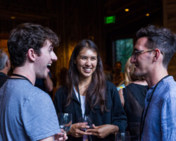 Creative producing fellows Tyler Rabinowitz, Shaandiin Tome, and Lance Oppenheim attend a closing night reception at the 2019 Creative Producing Summit. Photographer: Jonathan Hickerson