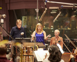 Director of the Sundance Institute Film Music Program Peter Golub, 'Holler' composer Ghiya Rushidat, and director Nicole Riegel speak with the orchestra. Photographer: Rob Williamson