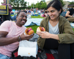 Guests enjoy a snack before a free Summer Film Series screening of 'Get Out.' Photographer: Lauren Wester