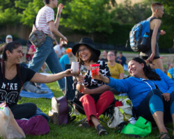 Guests hang out before a free screening of 'Get Out' at the Red Butte Garden Amphitheater. Photographer: Lauren Wester