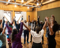 Lab participants share a moment during rehearsal for 'Dreaming Zenzile.' Photographer: Jen Fairchild