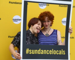 Guests take a turn in the photo booth at a community screening of 'Jockey' at Redwood Drive-In Theatre. Photographer: Simone Govan