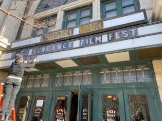 mama.film staff ready the marquee at Liberty Hall in Wichita, KS for satellite screenings during the 2022 Sundance Film Festival. Photographer: mama.film
