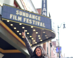 Festivalgoer in front of the Egyptian Theatre on Main Street. Photographer: Azikiwe Aboagye