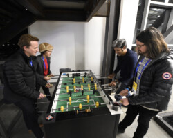 Festival programmers play a game of foosball during the Meet the Programmers event. Photographer: Stephen Speckman