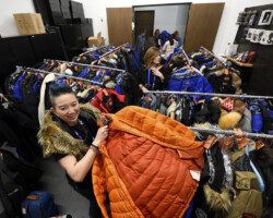 Festival volunteer manages the coat check at the Staff and Volunteer Party. Photographer: Stephen Speckman