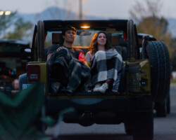 Attendees enjoy a community screening of 'Save Yourselves!' at a drive-in event held in conjunction with the Utah Film Center. Photographer: Jonathan Hickerson