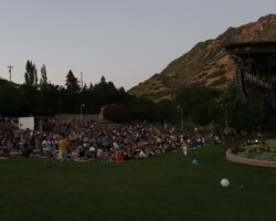 Atmosphere during the Local Lens screening at the Red Butte Garden Ampitheatre. Photographer: Ash Gerlach A wide-angle image of the audience as dusk falls upon the Red Butte screening area
