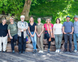 A group photo of the 2022 Directors Lab creative advisors and staff. Photographer: Jonathan Hickerson Nine individuals lined up, standing outdoors