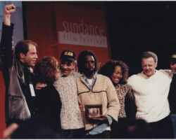 Producer Henri M. Kessler, Dramatic Competition Juror Alfre Woodard, director/screenwriter/producer Marc Levin, screenwriters/actors Saul Williams and Sonja Sohn, screenwriter/producer Richard Stratton, and cinematographer Mark Benjamin after winning the Grand Jury Prize: Dramatic for "SLAM" at the 1998 Sundance Film Festival. Photo by Brett Colvin