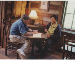 1999 June Screenwriters Lab fellow Perry Lin (right) workshops the script of his project “Hell” with a creative advisor. Photo by Sandria Miller