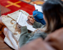 Feature Film Producers Lab fellow April S. Chang takes notes during a meeting. Photo by Lance Roth