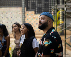 2024 Building Bridges fellows (r-l) Sherif Ibrahim, Fatima Wardy, Aqsa Altaf, and Samina Saifee listen on as they tour the Shangri La Museum of Islamic Art, Culture & Design. Photographer: Elyse Butler