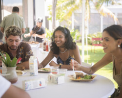 Fellows M. Akram Shibly, Colette Ghunim, and Aqsa Altaf during lunch at the 2024 Building Bridges Artist Retreat. Photographer: Elyse Butler