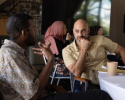 Fellows Yusuf Ahmed and Tarek Albaba meet during the 2025 Building Bridges Artist Retreat. Photographer: Elyse Butler