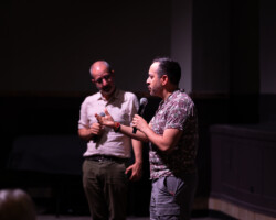 'TheyDream' director William D. Caballero introduces his film at a Local Lens 2026 screening MC'd by programmer Basil Tsiokos. Photographer: Breanna Downs