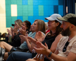 Audience members applaud during the introduction for the 'Union County' Local Lens 2026 screening. Photographer: Breanna Downs