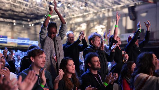 A crowd cheers to an award-winner at the 2024 Sundance Film Festival